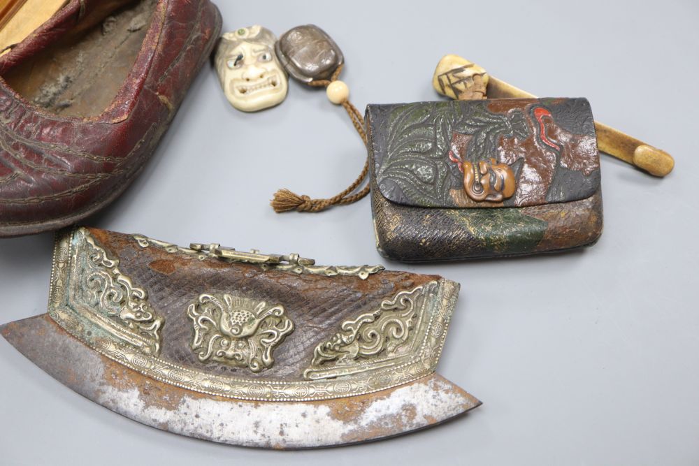 A Japanese ruyi sceptre okimono, together with a stamped leather tobacco pouch, a tinder strike, a leather Chinese childs shoe, a fan,
